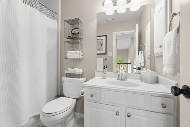 bathroom with vanity, toilet, and visible vents