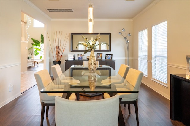 dining room featuring baseboards, dark wood-style floors, and plenty of natural light