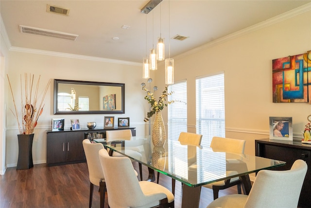 dining area featuring ornamental molding, visible vents, and dark wood-type flooring