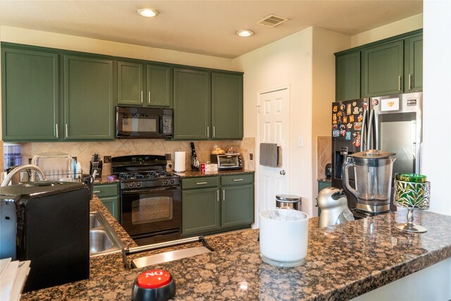 kitchen with visible vents, decorative backsplash, recessed lighting, green cabinetry, and black appliances