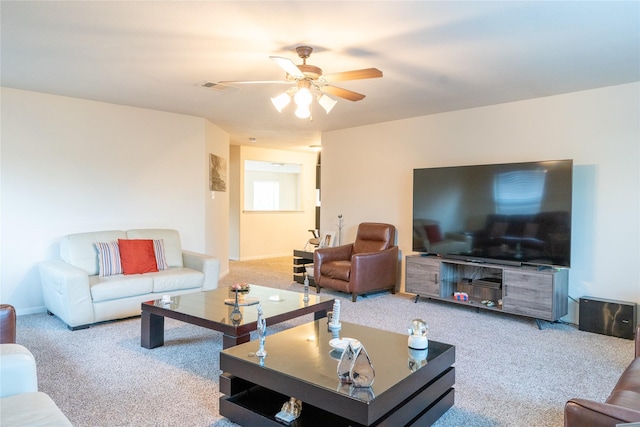 living room with baseboards, carpet, a ceiling fan, and visible vents