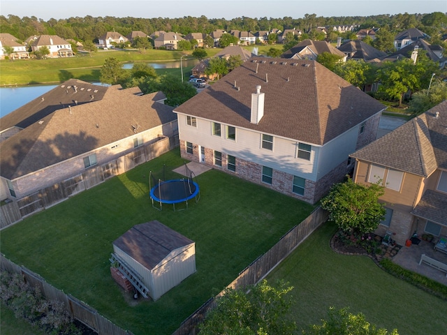 bird's eye view with a residential view and a water view