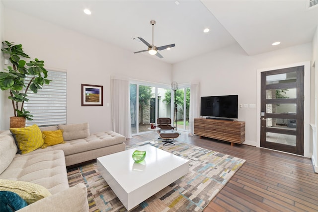 living area with ceiling fan, recessed lighting, baseboards, vaulted ceiling, and hardwood / wood-style flooring