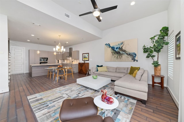living room featuring recessed lighting, dark wood-style floors, and visible vents