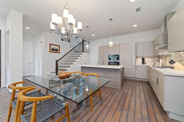 dining space with visible vents, stairs, dark wood-style floors, a chandelier, and recessed lighting