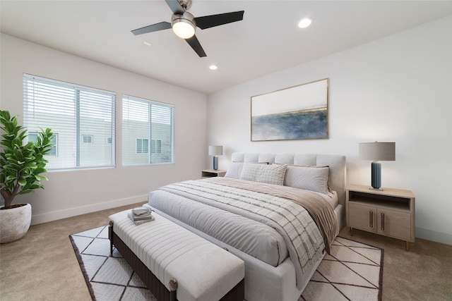 bedroom with recessed lighting, baseboards, light colored carpet, and ceiling fan