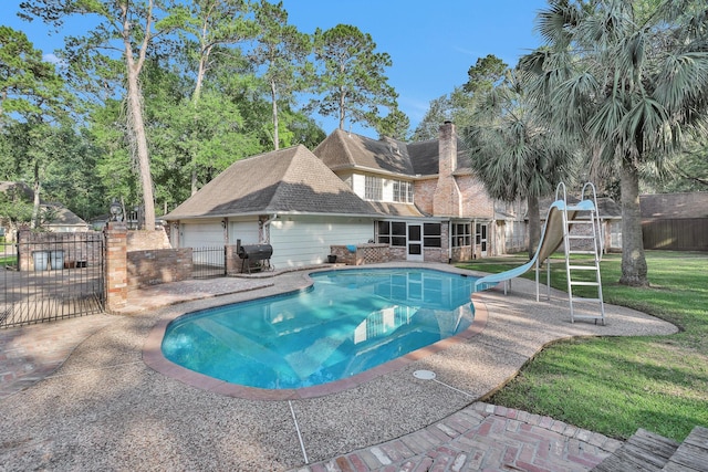 view of swimming pool with fence, area for grilling, a fenced in pool, a gate, and a water slide
