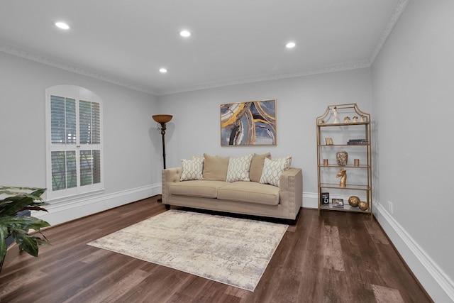 living area with recessed lighting, baseboards, ornamental molding, and dark wood-type flooring