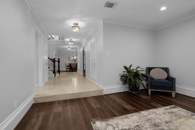 interior space featuring visible vents, an inviting chandelier, stairs, wood finished floors, and baseboards