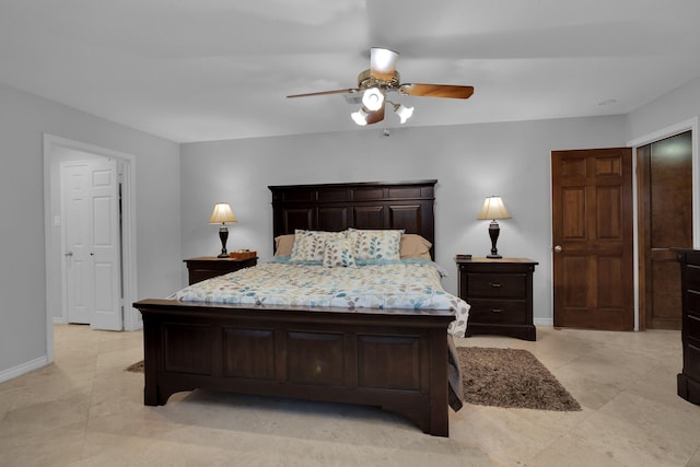 bedroom with baseboards, a ceiling fan, and light tile patterned flooring