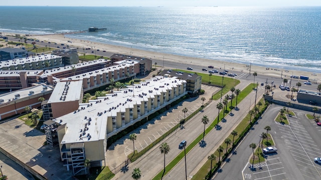 drone / aerial view with a beach view and a water view