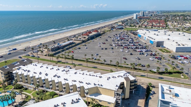 birds eye view of property with a beach view and a water view