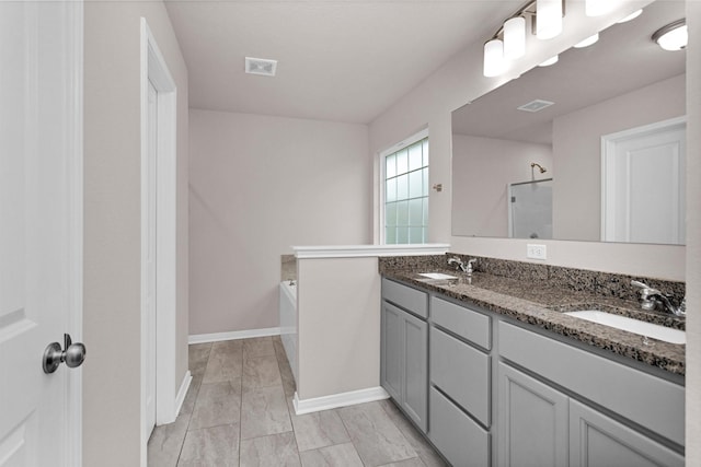 bathroom with double vanity, visible vents, a sink, and a shower