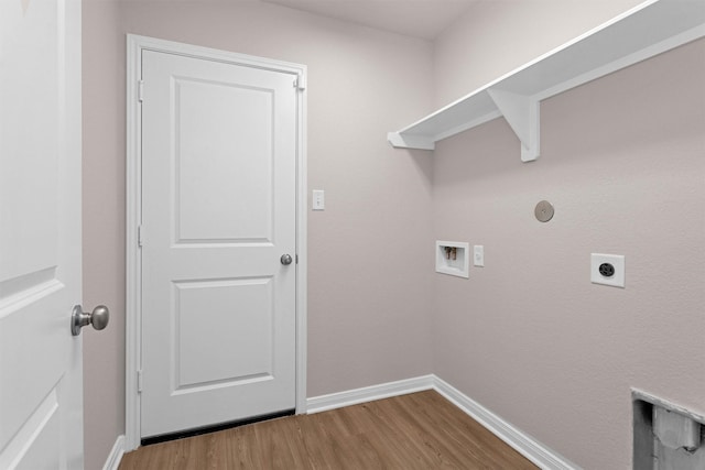 clothes washing area featuring laundry area, washer hookup, wood finished floors, and hookup for an electric dryer
