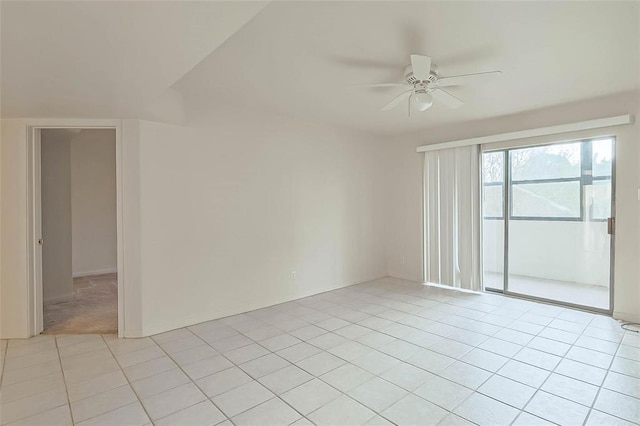 3045 Walnut Bend Ln Unit 27, Houston, TX 77042 - spare room with baseboards, ceiling fan, and light tile patterned floors