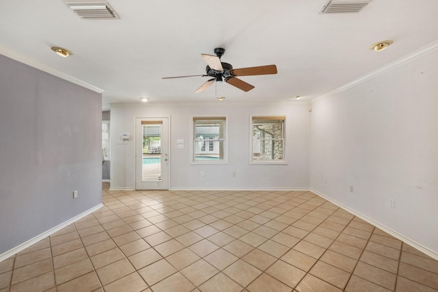 6625 E Post Rd, Kyle, TX 78640 - spare room featuring visible vents, crown molding, ceiling fan, and light tile patterned floors