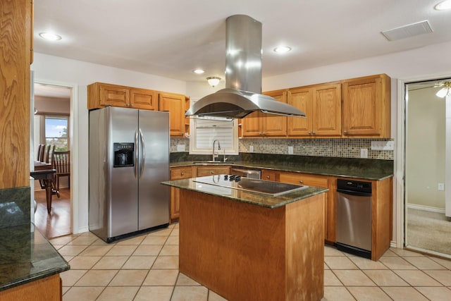 6625 E Post Rd, Kyle, TX 78640 - kitchen with a kitchen island, island range hood, backsplash, light tile patterned floors, and stainless steel appliances
