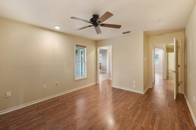 6625 E Post Rd, Kyle, TX 78640 - unfurnished room featuring a ceiling fan, baseboards, visible vents, and wood finished floors