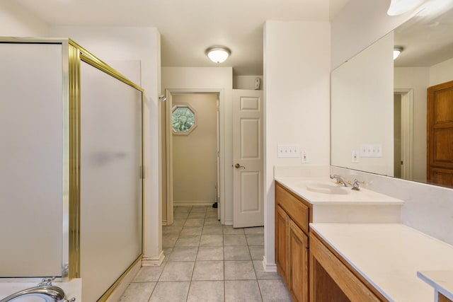 6625 E Post Rd, Kyle, TX 78640 - bathroom featuring vanity, tile patterned floors, and a stall shower
