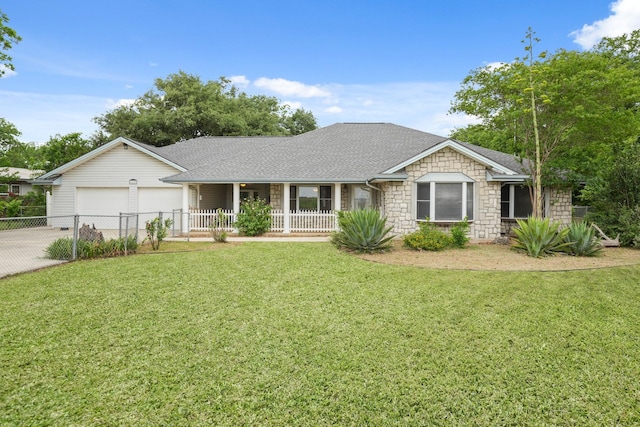 6625 E Post Rd, Kyle, TX 78640 - single story home featuring a garage, stone siding, a front yard, a porch, and driveway
