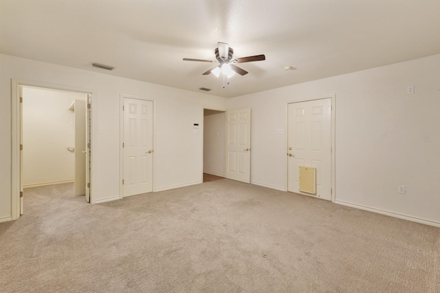 6625 E Post Rd, Kyle, TX 78640 - unfurnished bedroom featuring baseboards, carpet, a ceiling fan, and visible vents