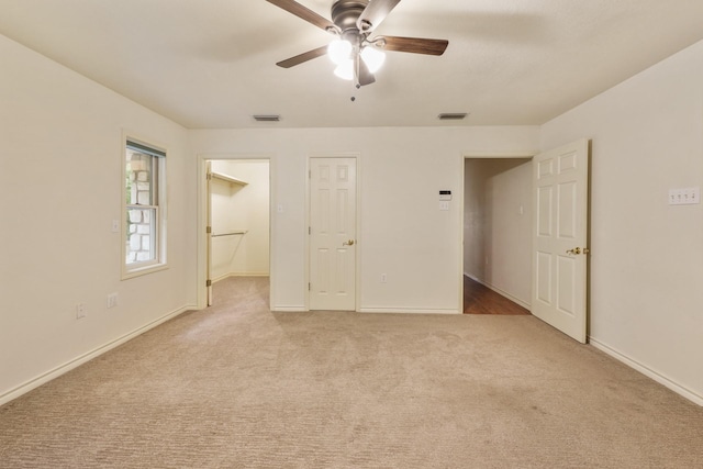 6625 E Post Rd, Kyle, TX 78640 - spare room with baseboards, ceiling fan, light colored carpet, and visible vents