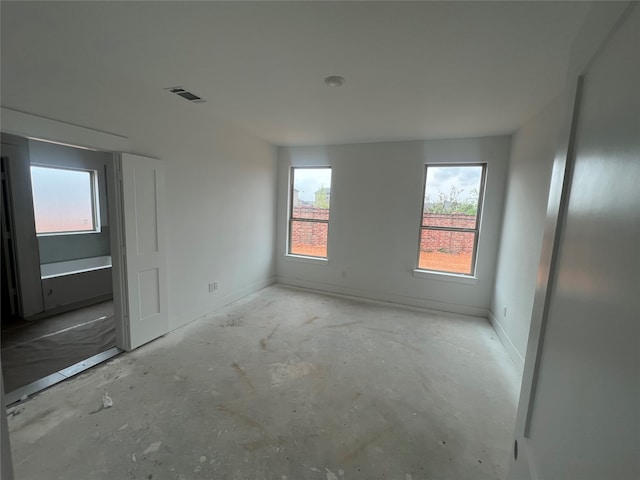 27111 Bel Air Point Ln, Katy, TX 77493 - unfurnished bedroom featuring baseboards, concrete flooring, and visible vents