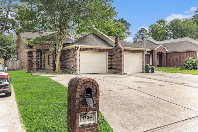 single story home with a front yard, brick siding, fence, concrete driveway, and an attached garage