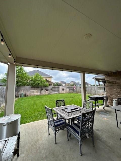 15419 Greenford Glen Dr, Cypress, TX 77429 - view of patio featuring outdoor dining area and a fenced backyard