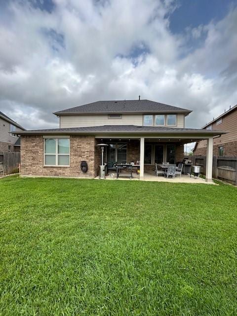 15419 Greenford Glen Dr, Cypress, TX 77429 - rear view of property with a lawn, a patio area, and a fenced backyard