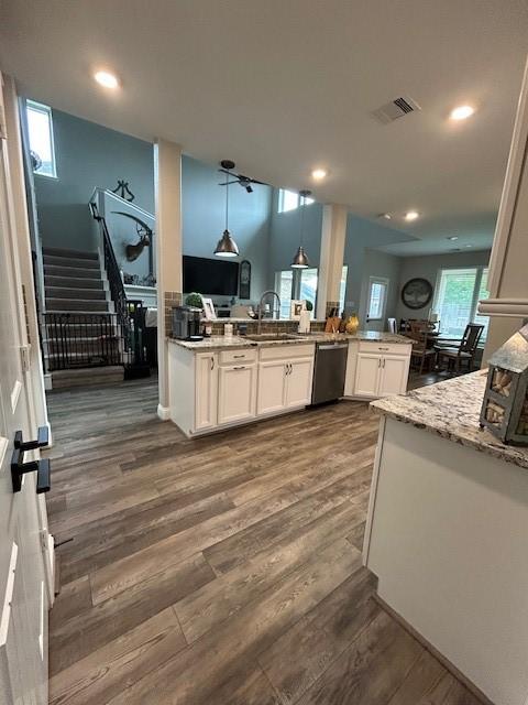 15419 Greenford Glen Dr, Cypress, TX 77429 - kitchen featuring a sink, stainless steel dishwasher, white cabinetry, and dark wood-style floors