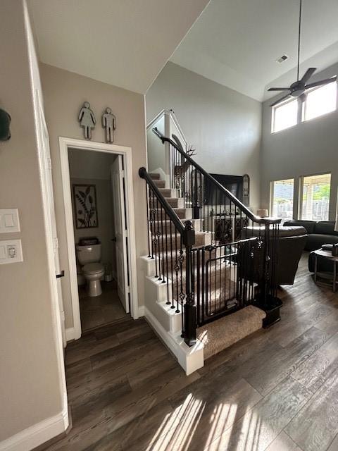 15419 Greenford Glen Dr, Cypress, TX 77429 - stairs featuring baseboards, wood finished floors, and a ceiling fan
