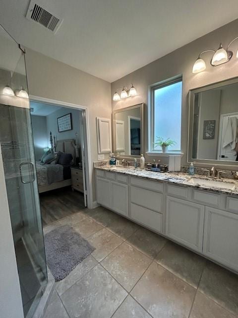15419 Greenford Glen Dr, Cypress, TX 77429 - full bath with a stall shower, ensuite bath, visible vents, a sink, and double vanity