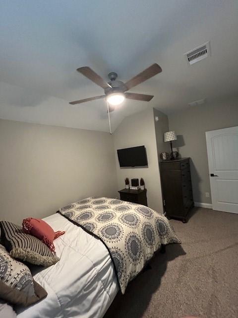 15419 Greenford Glen Dr, Cypress, TX 77429 - bedroom with a ceiling fan, light carpet, visible vents, and vaulted ceiling