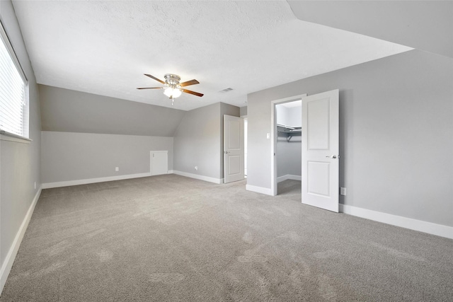 1226 Westgreen Blvd, Katy, TX 77450 - bonus room with carpet floors, ceiling fan, vaulted ceiling, and baseboards