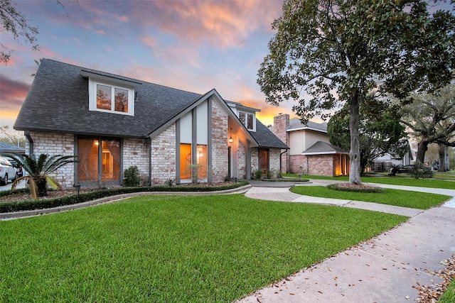1226 Westgreen Blvd, Katy, TX 77450 - view of front of property with a lawn, a shingled roof, and stone siding