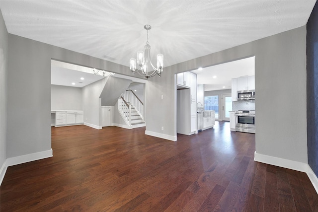 1226 Westgreen Blvd, Katy, TX 77450 - unfurnished dining area featuring stairway, baseboards, dark wood-style floors, and a notable chandelier
