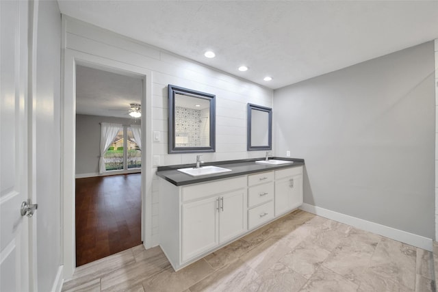 1226 Westgreen Blvd, Katy, TX 77450 - full bathroom featuring a sink, baseboards, a ceiling fan, and double vanity
