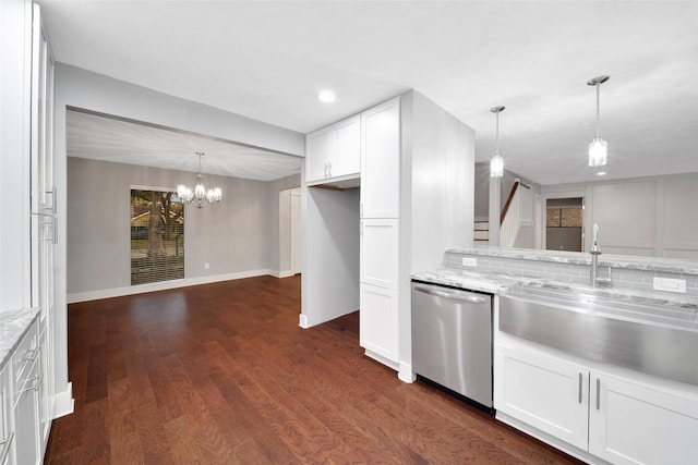 1226 Westgreen Blvd, Katy, TX 77450 - kitchen with stainless steel dishwasher, a sink, a chandelier, white cabinetry, and dark wood-type flooring