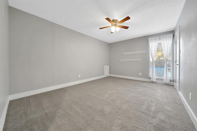 1226 Westgreen Blvd, Katy, TX 77450 - spare room featuring carpet floors, baseboards, and ceiling fan