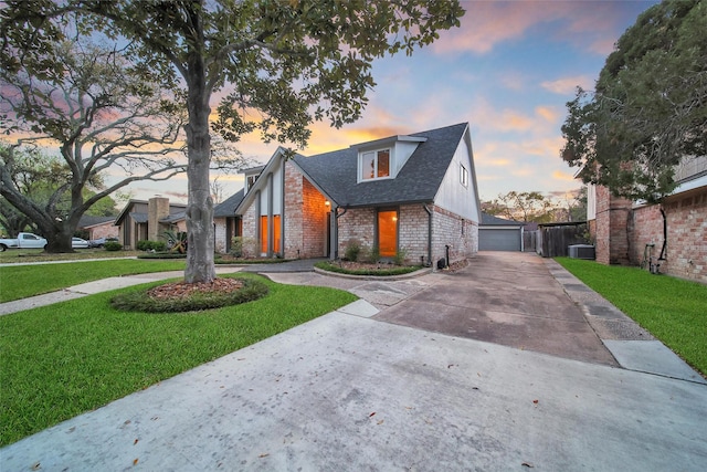 1226 Westgreen Blvd, Katy, TX 77450 - view of front of home featuring a detached garage, brick siding, central air condition unit, a yard, and a shingled roof