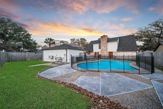 1226 Westgreen Blvd, Katy, TX 77450 - view of swimming pool featuring a lawn, a fenced backyard, a fenced in pool, and a patio