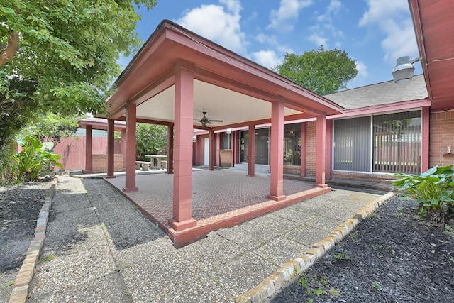 view of patio / terrace featuring a ceiling fan and fence