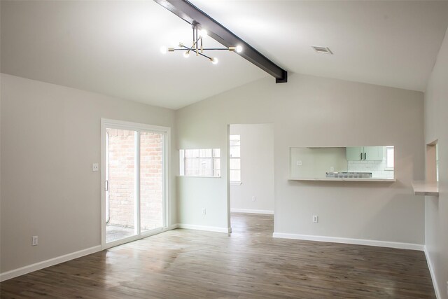 1222 Lynn Ln, Humble, TX 77338 - unfurnished living room featuring a chandelier, a wealth of natural light, wood finished floors, and visible vents