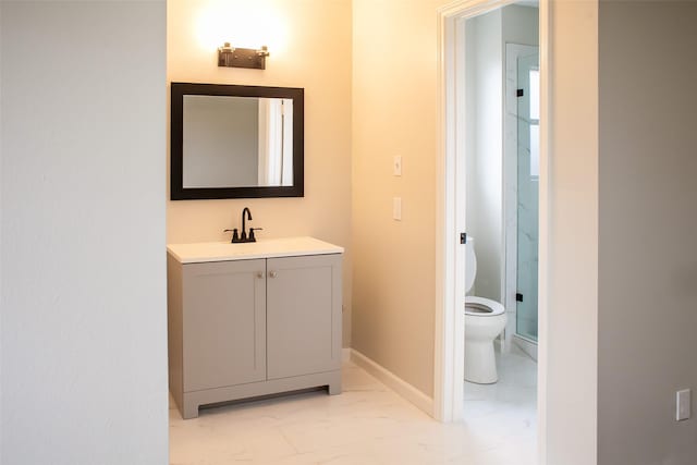 1222 Lynn Ln, Humble, TX 77338 - bathroom featuring a stall shower, vanity, baseboards, toilet, and marble finish floor