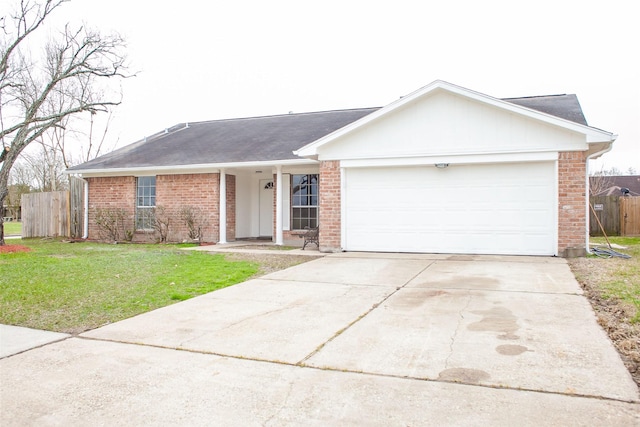 1222 Lynn Ln, Humble, TX 77338 - single story home featuring fence, an attached garage, a front lawn, and brick siding