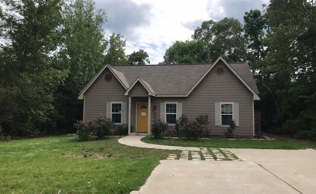 3490 Frontier Rd, Willis, TX 77378 - ranch-style home featuring a front yard
