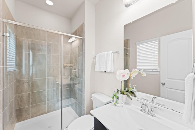 full bath featuring vanity, recessed lighting, toilet, and a shower stall
