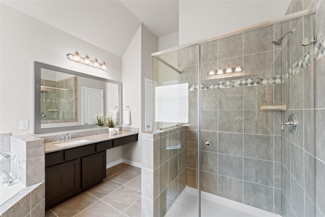 bathroom featuring vanity, a bath, tile patterned floors, and a shower stall