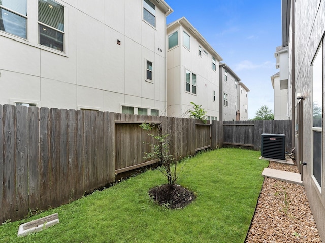 view of yard featuring a fenced backyard and cooling unit